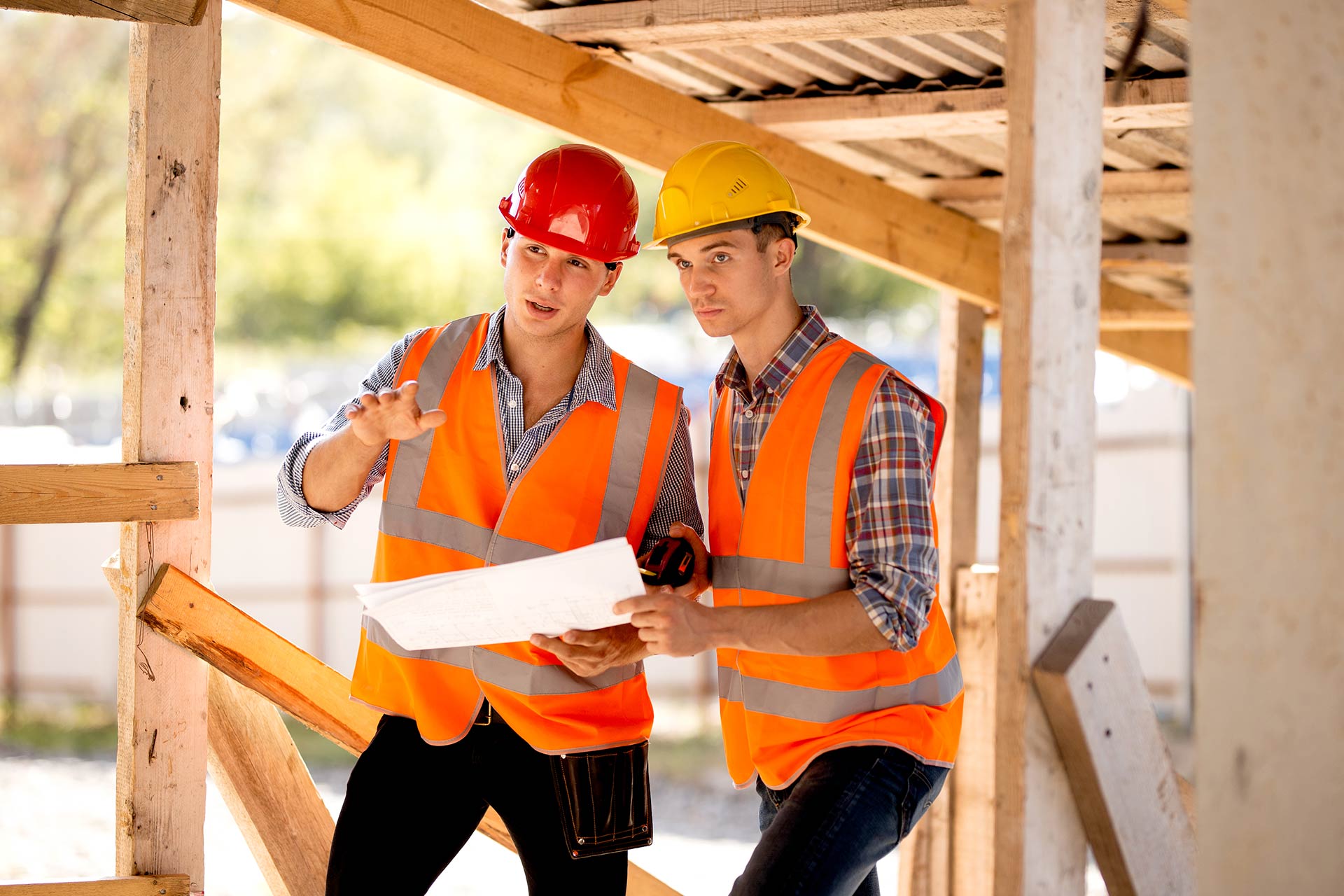 two-men-dressed-in-shirts-orange-work-vests-and-he-KE9JMU2.jpg